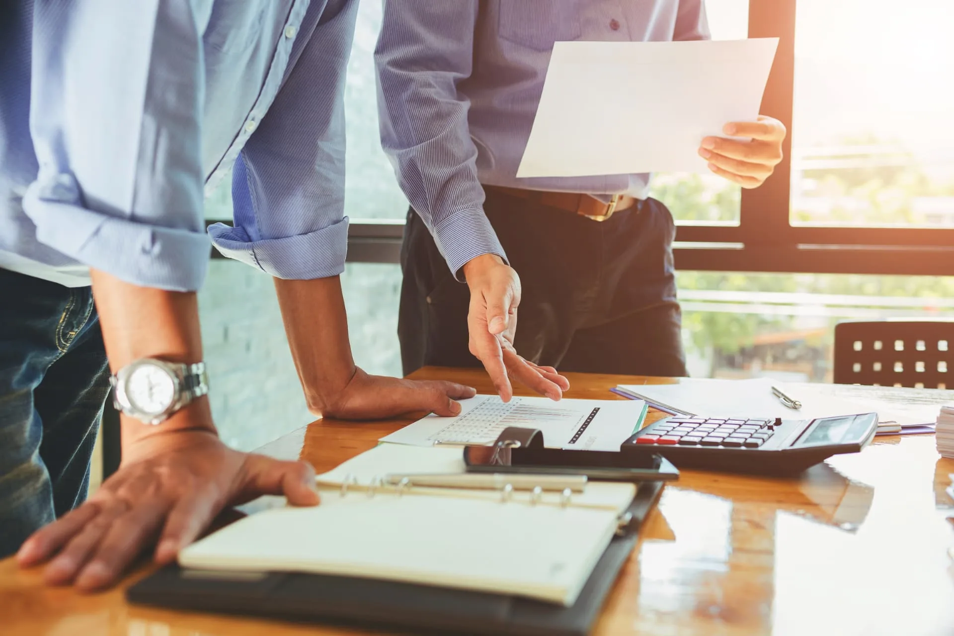 Two professionals reviewing income charts - self-employed mortgage guides